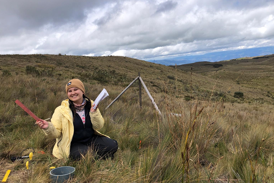 Sabriya Seid sitting in a field site in moutains of Ecuador.